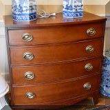 F26. Maddox Colonial Reproductions bow front 4-drawer mahogany chest. 34”h x 32”w x 18”d 